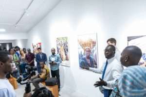 Paul Ninson interacting with some patrons at the launch of the Dikan Center in Accra, Ghana. Photograph: Ernest Ankomah