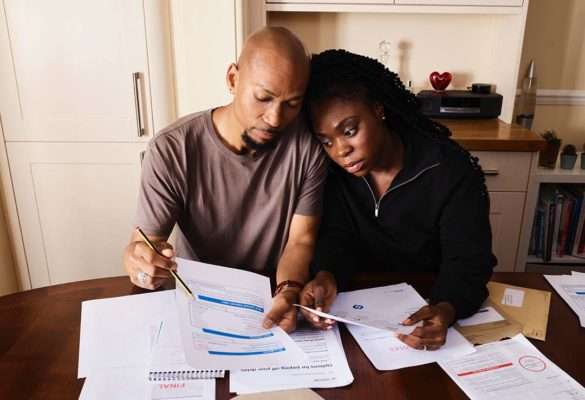 Couple reviewing their expenses. Source: Pexel