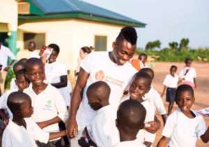 This is Christian Atsu interacting with kids during one of his charitable events