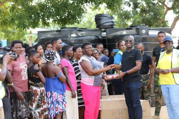 Emmanuel Antwi-Darkwa, Chief Executive of VRA donating items to members of an impacted community